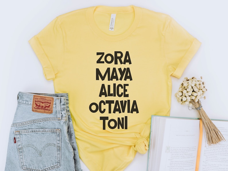 May include: Yellow t-shirt with black text that reads "Zora Maya Alice Octavia Toni".