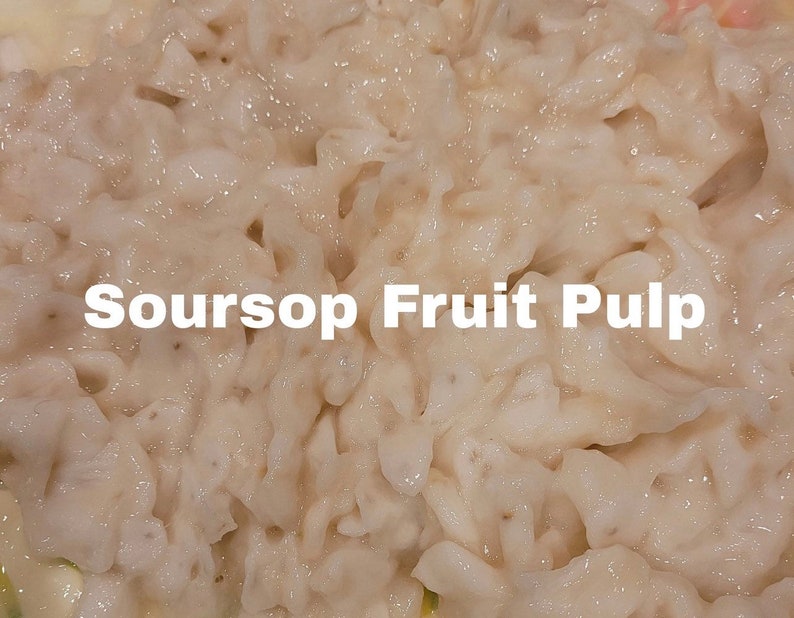 May include: Close-up of white soursop fruit pulp. The pulp is soft and creamy, with a slightly grainy texture. Soursop Fruit Pulp is written in white text on the image.