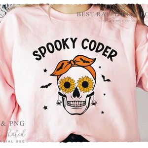 May include: Pale pink sweatshirt with the words "SPOOKY CODER" in black. The design includes a skull with sunflower eyes, an orange bandana, bats, stars, and spiders. The text "SVG & PNG" and "Best Rated" are also visible.