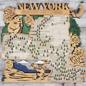 May include: A wooden map of New York State Park locations. The map is decorated with a beaver, a fish, and roses. The map is made of light wood with a white background and black text. The map is titled "New York State Park Map".