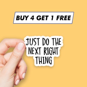 May include: White sticker with black text that reads "Just do the next right thing". A hand is holding the sticker. The sticker is on a yellow background. The text "BUY 4 GET 1 FREE" is in a blue rectangle at the top of the image.