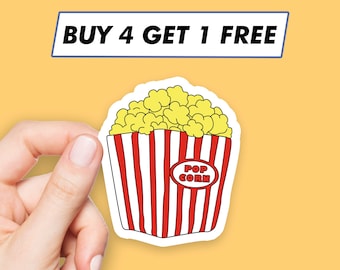 May include: A sticker of a popcorn container with red and white stripes, filled with yellow popcorn. The sticker has the text "POP CORN" on the front. The text "BUY 4 GET 1 FREE" is above the sticker.
