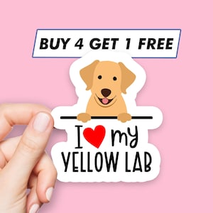 May include: A white sticker with a cartoon yellow Labrador Retriever peeking over a black bar. The sticker says "I love my yellow lab" with a red heart. The text "BUY 4 GET 1 FREE" is on a blue bar above the sticker.