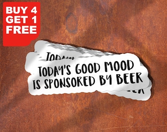 May include: White sticker with the text "TODAY'S GOOD MOOD IS SPONSORED BY BEER" in a bold, black font. A red rectangle in the upper left corner reads "BUY 4 GET 1 FREE". The background is a textured, rusty brown.