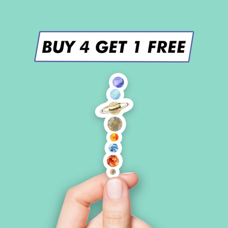 May include: A hand holds a sticker of the planets in our solar system, with the text "BUY 4 GET 1 FREE" above it.