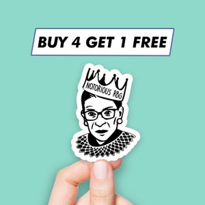 May include: Black and white sticker of Ruth Bader Ginsburg wearing a crown that says "Notorious RBG".
