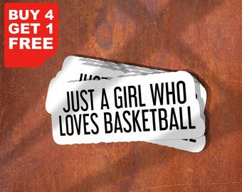 May include: White stickers with the text "JUST A GIRL WHO LOVES BASKETBALL" stacked on top of each other. A red corner with the text "BUY 4 GET 1 FREE" is in the upper left corner. The background is a textured, rusty brown.