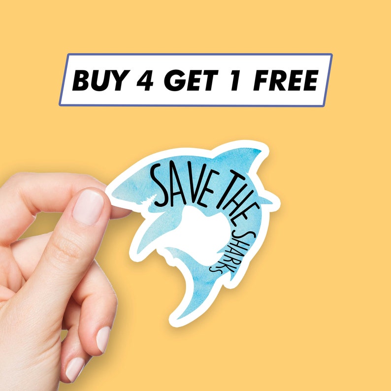 May include: A blue watercolor shark sticker with the text "Save the Sharks" in black. The sticker is being held by a hand. The background is a solid yellow color. The text "Buy 4 Get 1 Free" is displayed in a blue rectangle at the top of the image.