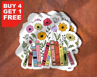 May include: A stack of colorful books with flowers growing out of the top. The books have different patterns and designs. The flowers are pink, yellow, red, and purple. The background is a rusty brown color.