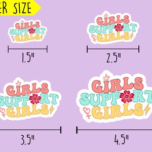May include: Four different sizes of stickers with the text "Girls Support Girls" in a retro font. The stickers are in pink, blue, and yellow with a flower and lightning bolt graphic. The stickers are 1.5 inches, 2.5 inches, 3.5 inches, and 4.5 inches wide.