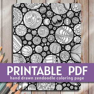 May include: Black and white printable colouring page featuring a pattern of overlapping circles with intricate designs. The circles are arranged in a random pattern and create a visually appealing design.  "Printable PDF" and "hand drawn zendoodle colouring page" are written in black text at the bottom of the page.