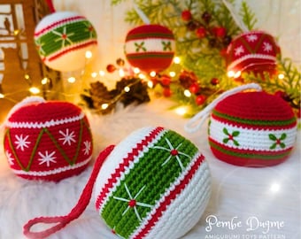 May include: Crocheted Christmas ornaments in red, white, and green. The ornaments feature various patterns, including snowflakes and geometric designs. Each ornament has a loop for hanging. The overall theme is festive and handmade.