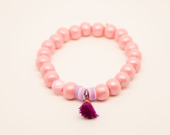 Wooden bead bracelet with Heishi, Katsuki, polymer beads as well as heart bead and tassel