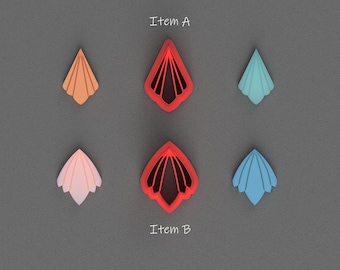 Op de afbeelding: Zes decoratieve papieren uitsnijdingen in de vorm van een gestileerde bloem. De uitsnijdingen zijn in verschillende kleuren, waaronder rood, oranje, roze, blauw en lichtblauw. De uitsnijdingen zijn gelabeld met "Item A" en "Item B".