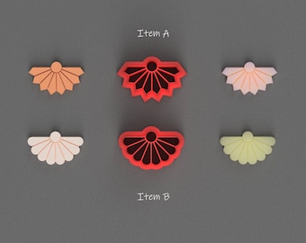 May include: Six decorative flower-shaped cookie cutters, two each in orange, pink, and yellow, and one red cookie cutter in the center. The text "Item A" is above the top row of cookie cutters and the text "Item B" is below the bottom row of cookie cutters.