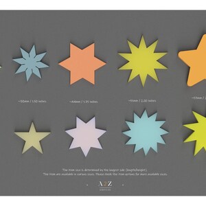 May include: A chart showing different sizes of star-shaped paper cutouts. The stars are in various colors, including yellow, orange, blue, and green. The chart includes the measurements of each star in millimeters and inches.