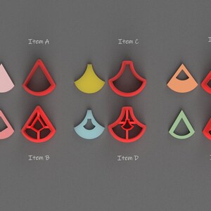 May include: Six pairs of cookie cutters, each with a different design. The cutters are red, pink, orange, yellow, blue, and green. The cutters are shaped like a triangle with a rounded top and a flat bottom. The cutters are labeled "Item A", "Item B", "Item C", "Item D", "Item E", and "Item F".