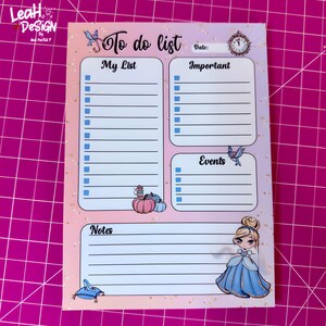 May include: A pastel-colored to-do list notepad with sections for 'My List', 'Important', 'Events', and 'Notes'. The design includes illustrations of a butterfly, a clock, pumpkins, and a princess. The notepad has a pink and peach gradient background.