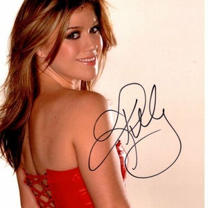 Kelly Clarkson ha firmato la foto autografata 8x10