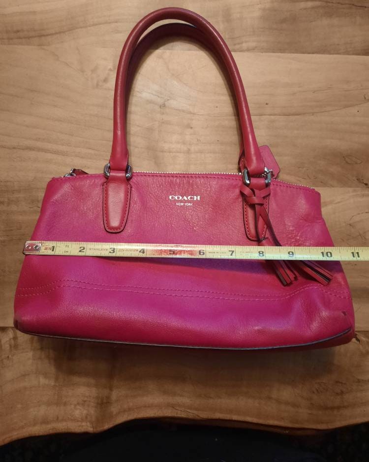 Pink coach clutch hotsell