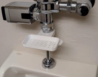 Bandeja para desechar bolsas de nicotina en urinarios