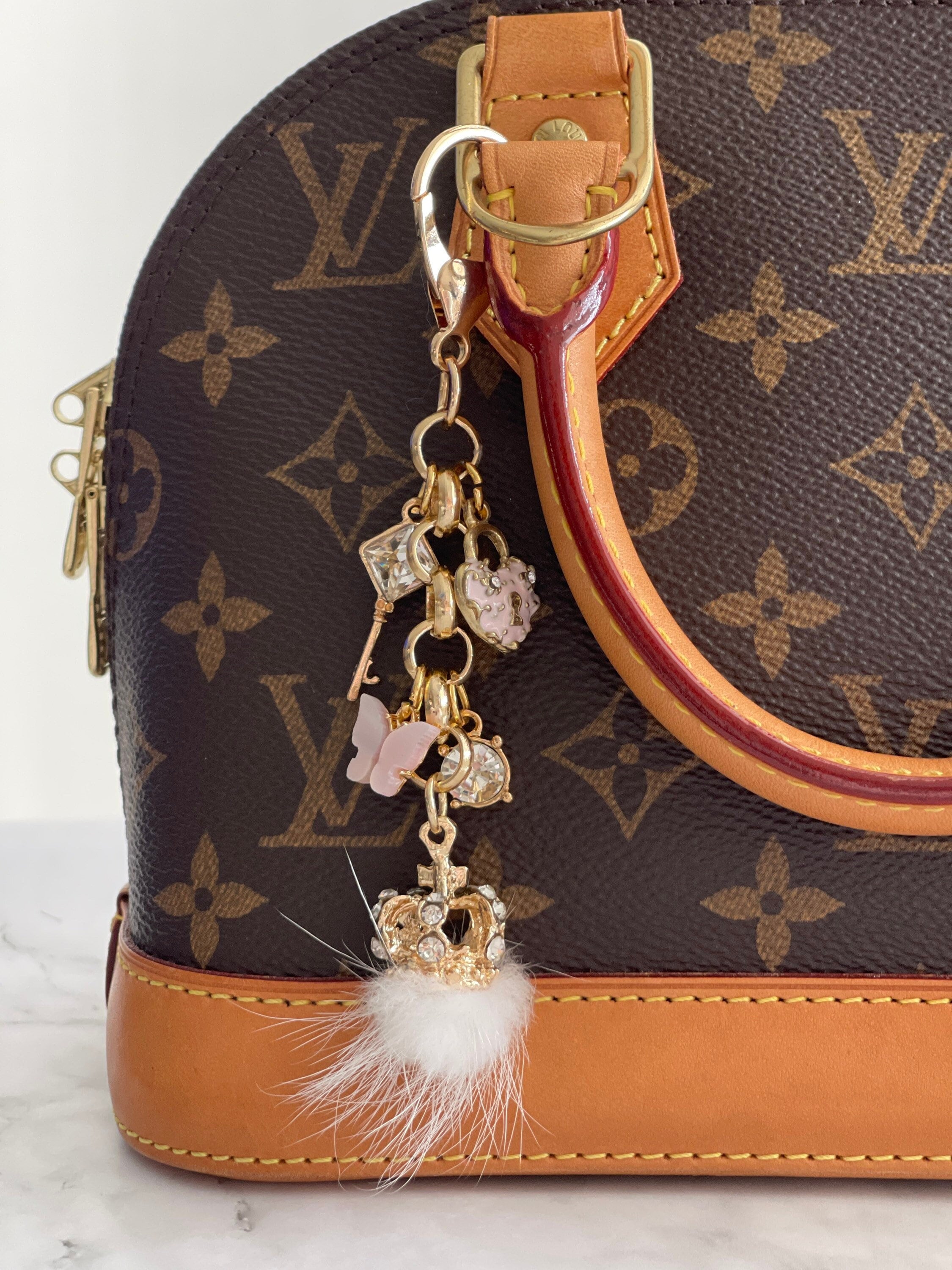 Louis Vuitton Fuzzy V Fox Fur Keychain Bag Charm Amarant M67370