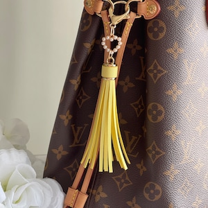 Yellow Faux (Vegan) Leather Tassel Handbag/Purse Charm .Price includes taxes,tariffs,shipping. Beautifully gift wrapped