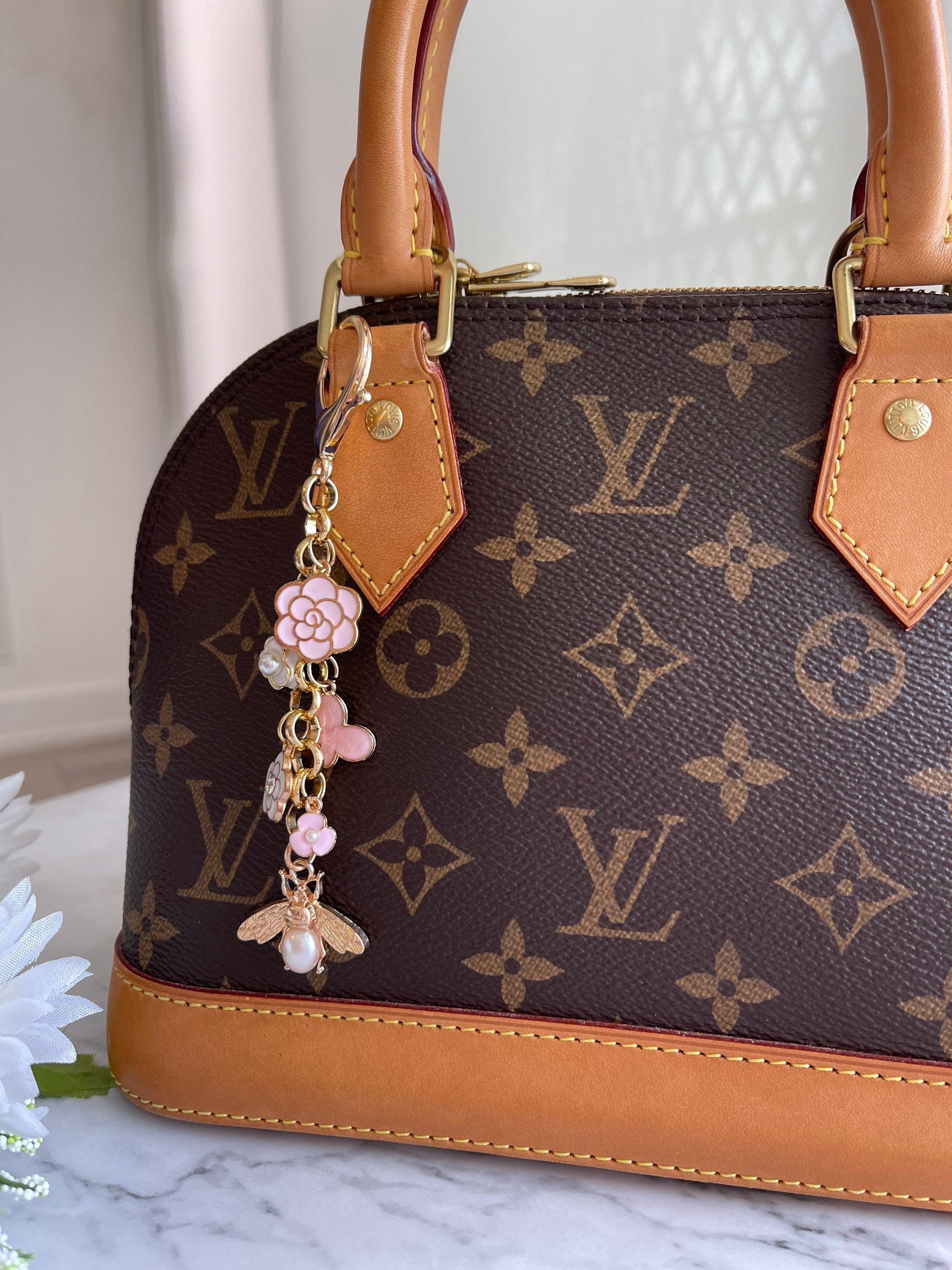 Louis Vuitton Fleur de Monogram Bag Charm and Key Holder Resin and Brass (Authentic Pre-Owned)