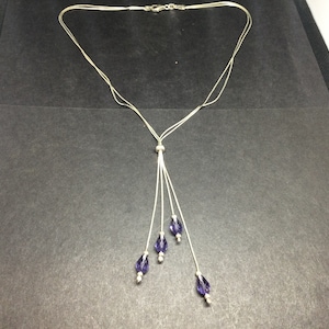 Silver necklace with purple drops