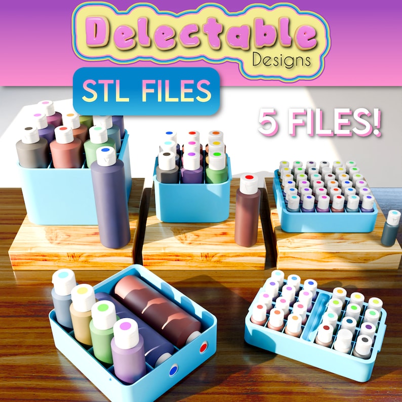 May include: Five 3D printed organizers for small bottles of paint. The organizers are light blue and come in different sizes. The organizers are filled with colorful bottles of paint. The text "STL FILES" and "5 FILES!" is visible in the image.