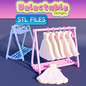 May include: A pink wooden clothes rack with five white dresses hanging on it. The rack is on a blue surface. The text "Delectable Designs" and "STL FILES" is visible in the image.