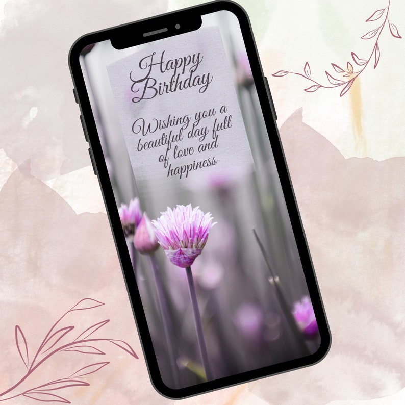 May include: A smartphone screen displaying a birthday greeting with a purple flower in the background. The message reads "Happy Birthday. Wishing you a beautiful day full of love and happiness."