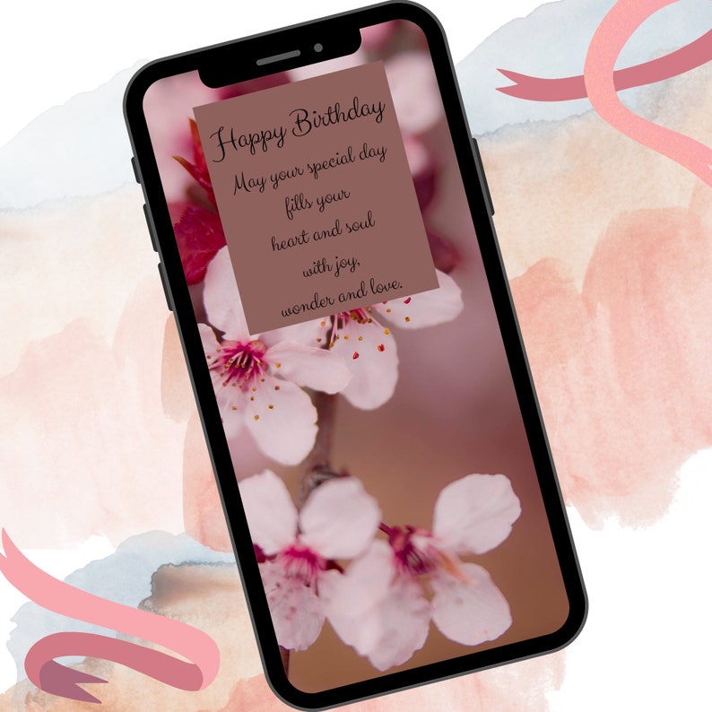 May include: A phone screen displaying a birthday message with pink flowers in the background. The message reads: "Happy Birthday. May your special day fills your heart and soul with joy, wonder and love."
