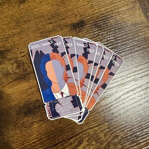 May include: A set of six colorful ticket-shaped stickers featuring a stylized illustration of a person with a blue and orange color scheme. The stickers are for the SUGA | Agust D TOUR, The Pal Live Streaming, August 15, 2023, Saturday 6:00 PM KST, RSPO DOME, Seoul, Korea.
