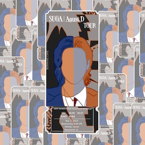May include: A ticket for the Suga Agust D Tour, featuring a stylized illustration of Suga with a blue and orange color scheme. The ticket is for May 3, 2023 at the Allstate Arena in Rosemont, Illinois. The ticket is for section GA2, row GA3.
