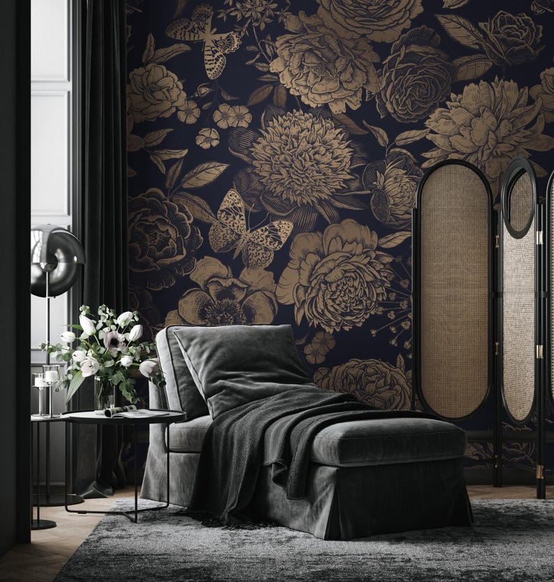 May include: A dark navy blue wallpaper featuring a repeating pattern of large, detailed gold-toned flowers and butterflies. The floral design includes various blossoms and foliage rendered in a sketch-like style against a solid dark background.
