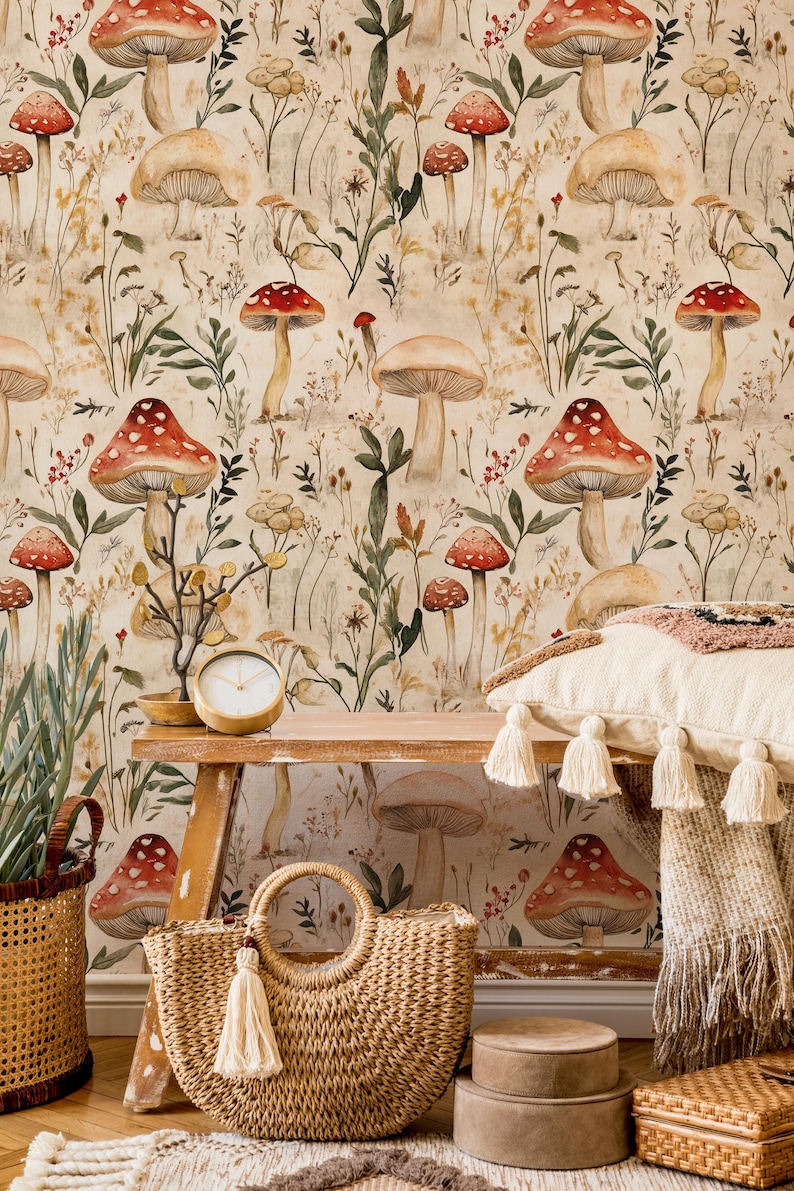 May include: A beige wallpaper with a repeating pattern of red and white mushrooms and green foliage. The wallpaper is in a room with a wooden bench, a woven bag, and other decorative items.