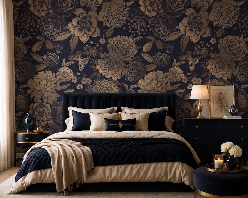 May include: A bedroom featuring a dark blue upholstered headboard and bedding in navy and beige. The wall is covered in wallpaper with a dark blue background and a repeating pattern of large, detailed gold-toned flowers and butterflies.