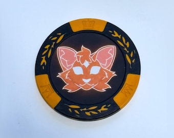 Moneda de cara y cruz de los Gatos Guerreros
