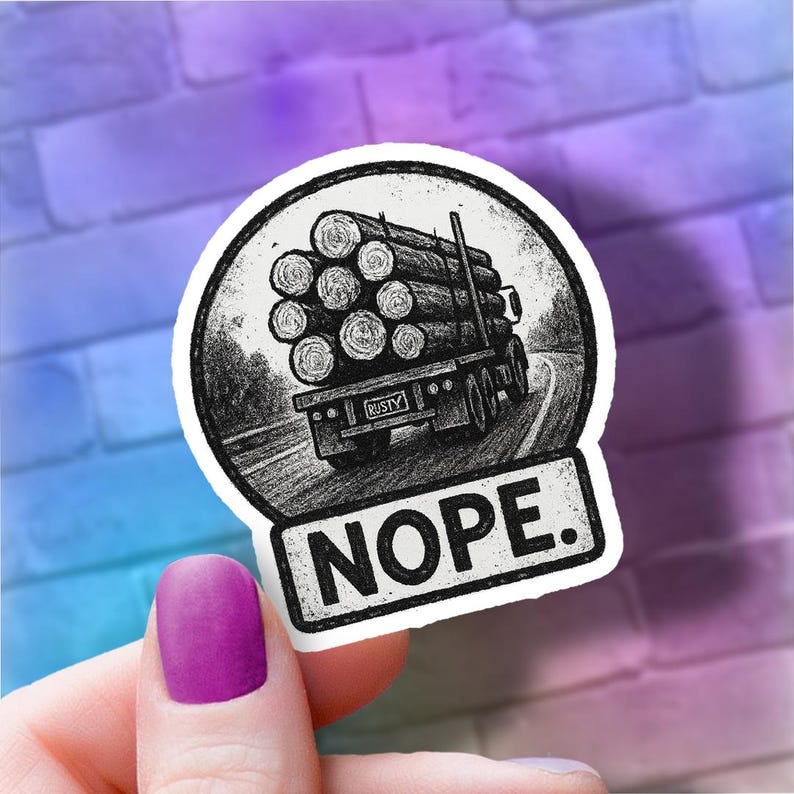 May include: A black and white sticker featuring a truck hauling logs on a winding road. The truck has the license plate "RUSTY" and the word "NOPE." is below the image. The sticker is round with a white border.