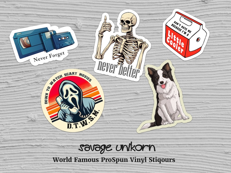 May include: Five vinyl stickers with various designs. One sticker features a cassette tape and a VHS tape with the text "Never Forget". Another sticker features a skeleton with the text "never better". A third sticker features a cartoon ghost with a phone and the text "Down to watch scary movies D.T.W.S.M.". A fourth sticker features a cartoon dog with the text "savage unikorn World Famous ProSpun Vinyl Stiqours". The last sticker features a red cooler with the text "Don't hate me because I'm a Little Cooler".