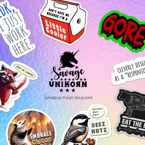 May include: A collection of nine stickers with various designs and text. The stickers include a raccoon with knives, a unicorn, a possum, a bird, a cow, and text that says "IDK, I just work here", "Don't hate me because I'm a little cooler", "Gore", "Savage Unikorn", "Cleverly disguised as a "responsible adult"", "Embrace Chaos", "Deez Nutz", and "Eat the Beef".