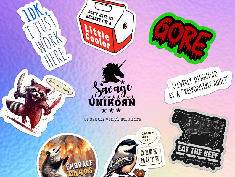 May include: A collection of nine stickers with various designs and text. The stickers include a raccoon with knives, a unicorn, a possum, a bird, a cow, and text that says "IDK, I just work here", "Don't hate me because I'm a little cooler", "Gore", "Savage Unikorn", "Cleverly disguised as a "responsible adult"", "Embrace Chaos", "Deez Nutz", and "Eat the Beef".