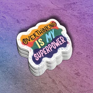 May include: A sticker with a rainbow design and the text "Overthinking is my superpower" in a colorful, hand-drawn style.