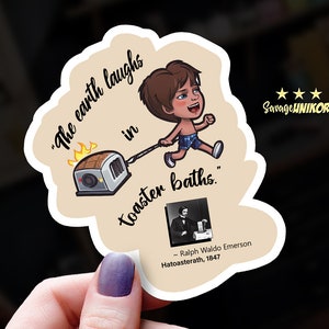 May include: A cartoon sticker of a boy pulling a toaster with flames coming out of it. The text on the sticker reads "The earth laughs in toaster baths." - Ralph Waldo Emerson, Hatoasterath, 1847.