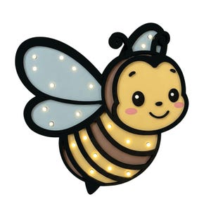 May include: A light-up wooden bee nightlight with a cute cartoon face, brown and yellow stripes, and blue wings. The bee has a small crown on its head and 10 small white LED lights.