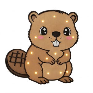 May include: A brown wooden beaver night light with a smiling face and a tail. The beaver has a light brown body and a dark brown tail. The night light has 12 small white lights that illuminate the beaver's face and body.