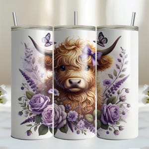 May include: Three stainless steel tumblers with a white background and a floral design featuring purple flowers, green leaves, and a brown and white Highland cow with a purple bow.