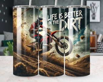 May include: A stainless steel tumbler with a dirt bike rider jumping over a dirt track. The tumbler has a graphic that says "Life is better in the dirt".