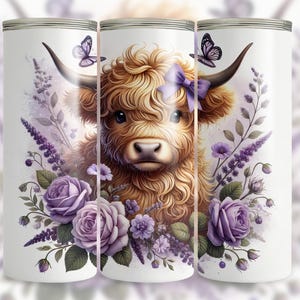 May include: A white tumbler with a colorful illustration of a Highland cow with a purple bow, surrounded by purple flowers and butterflies.